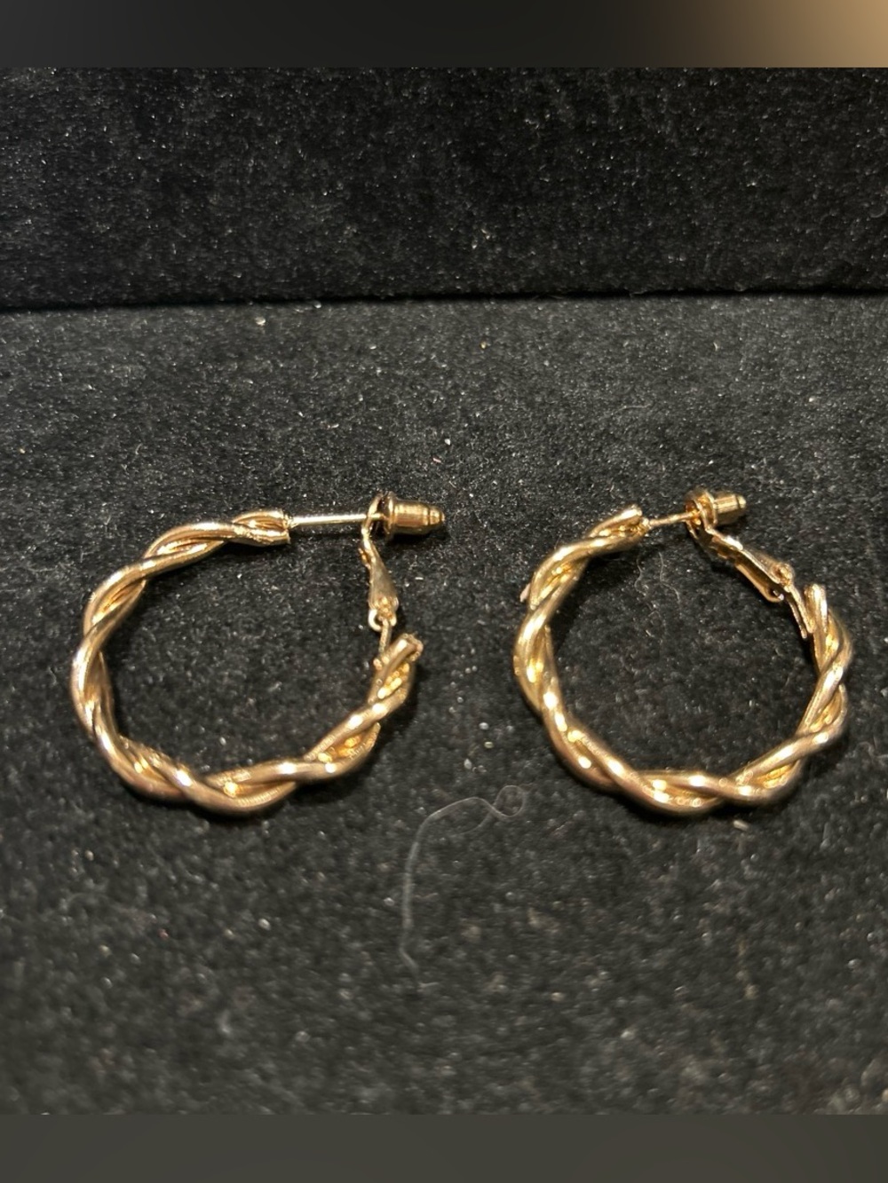 Gold color twisted hoop earrings